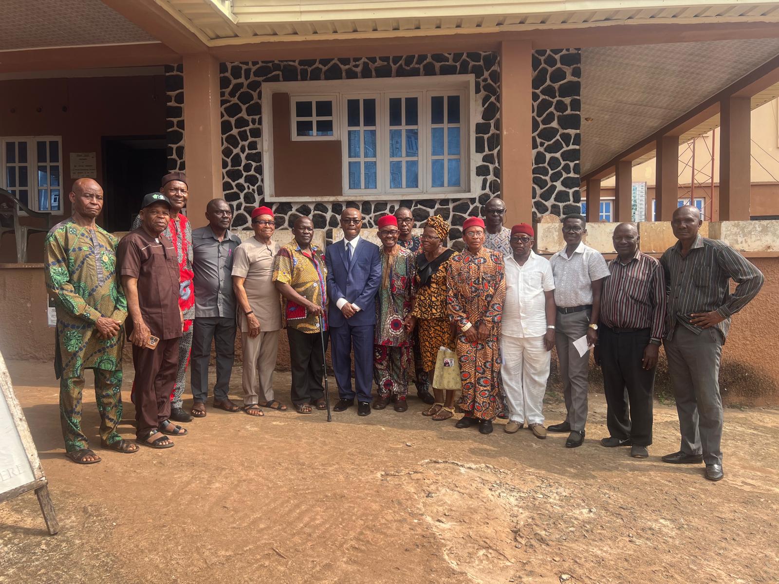 MEDIA collaborators gathered together outside a community building